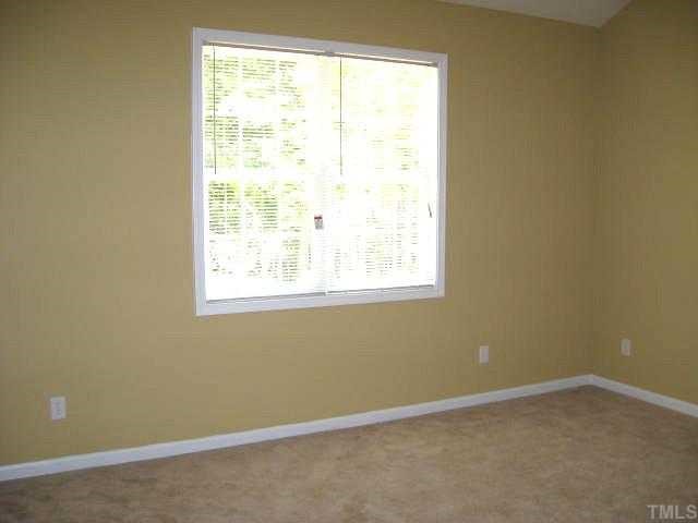2529 Friendly Trail Raleigh, NC 27610 - Photo 6 of 12 an empty room with a window