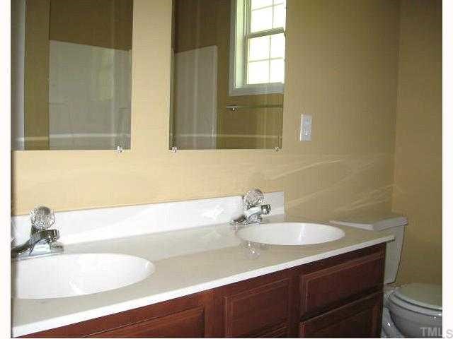 2529 Friendly Trail Raleigh, NC 27610 - Photo 7 of 12 a bathroom with a sink and a bathtub