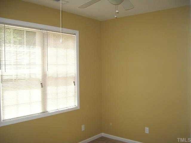 2529 Friendly Trail Raleigh, NC 27610 - Photo 8 of 12 a view of an empty room with a window