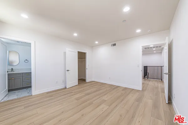 a view of a livingroom with wooden floor