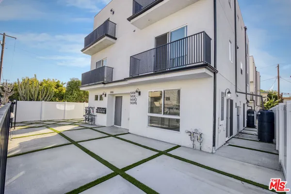 a view of a house with a street
