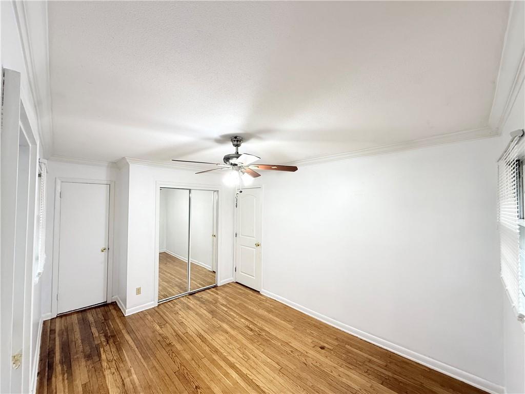 3276 Pin Oak Circle Atlanta, GA 30340 - Photo 11 of 22 a view of a livingroom with wooden floor and a ceiling fan
