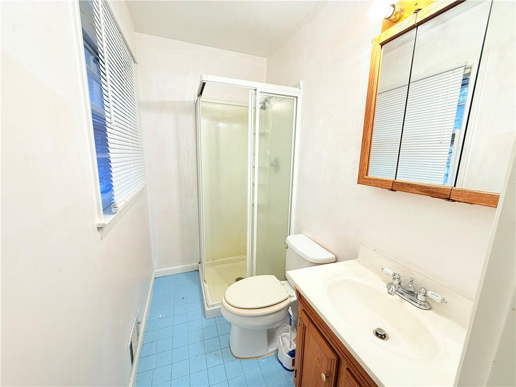 3276 Pin Oak Circle Atlanta, GA 30340 - Photo 12 of 22 a bathroom with a sink a toilet and shower