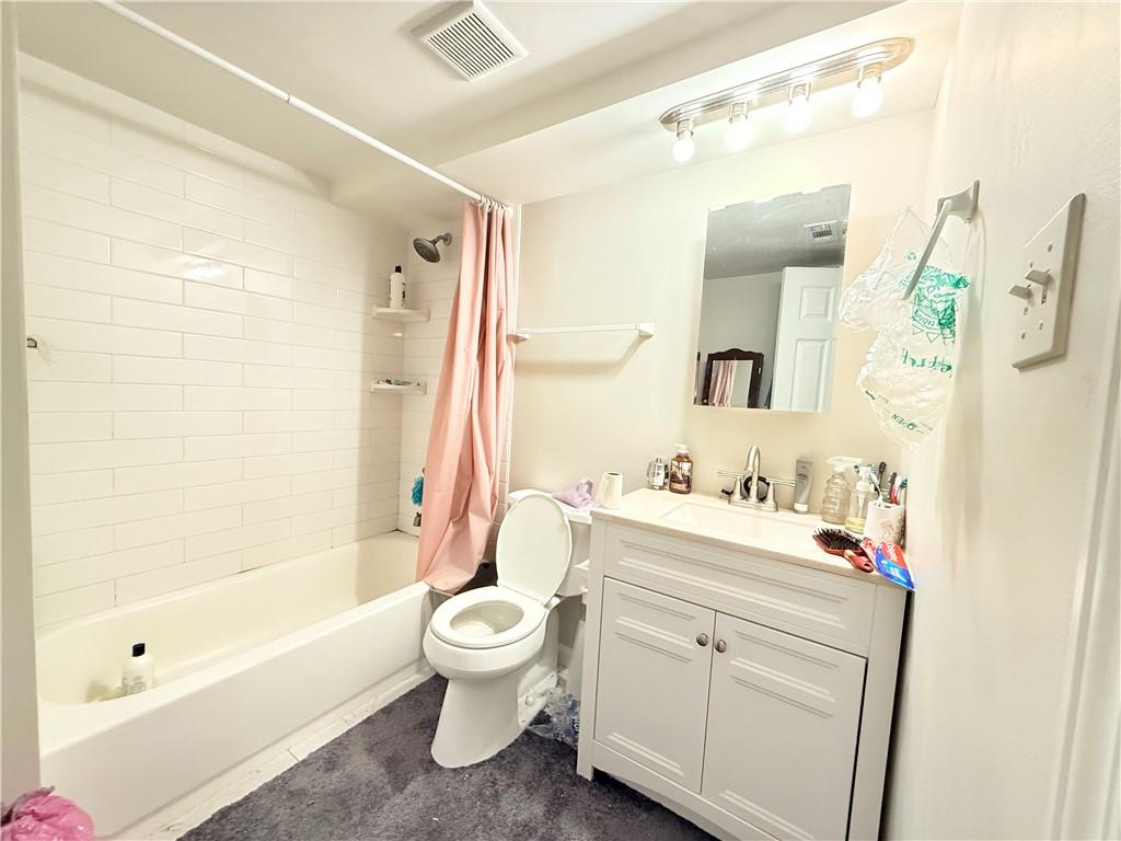 3276 Pin Oak Circle Atlanta, GA 30340 - Photo 14 of 22 a bathroom with a sink a toilet and a mirror