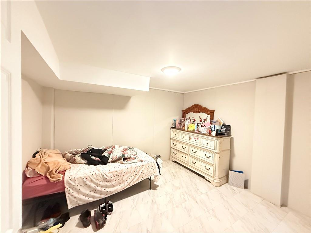 3276 Pin Oak Circle Atlanta, GA 30340 - Photo 15 of 22 a bedroom with a bed and a dresser