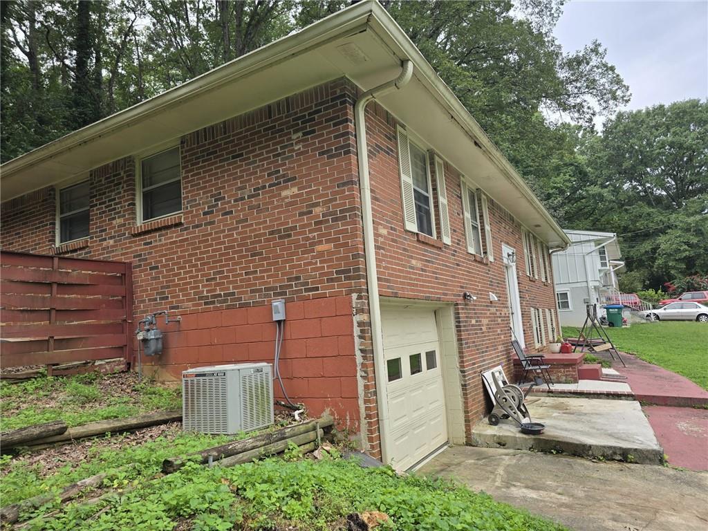 3276 Pin Oak Circle Atlanta, GA 30340 - Photo 19 of 22 a view of a brick house with a chairs in patio