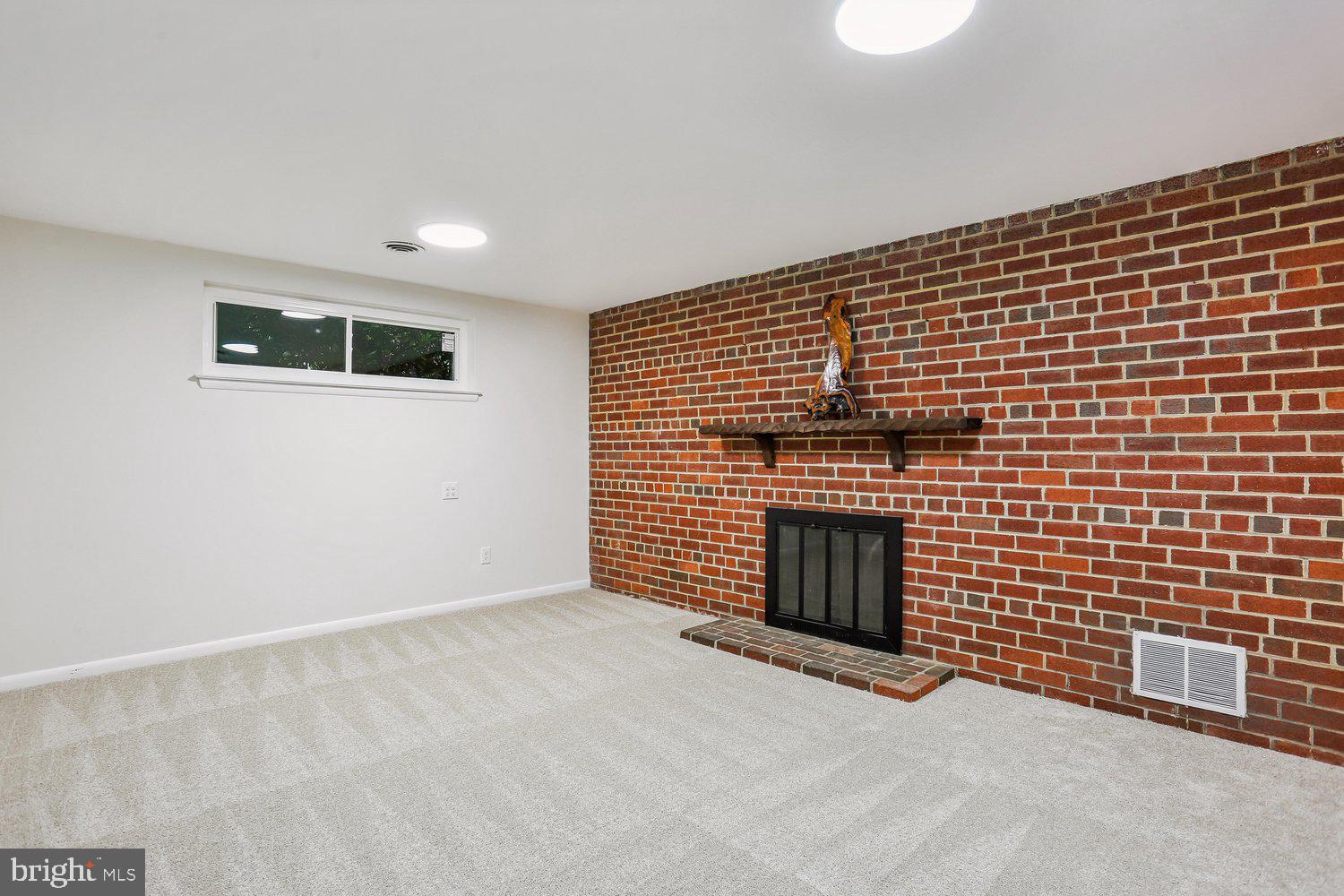907 Hoyt Street Silver Spring, MD 20902 - Photo 42 of 69 a view of an empty room with a fireplace