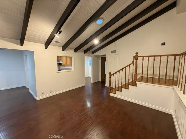 a kitchen with granite countertop a sink and a stove top oven