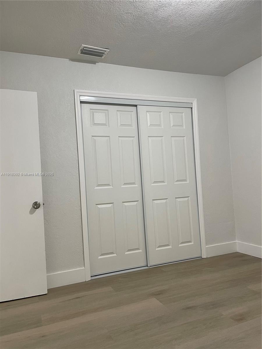 5261 Northwest 1st Street, Unit FRONT Miami, FL 33126 - Photo 12 of 14 a view of an empty room