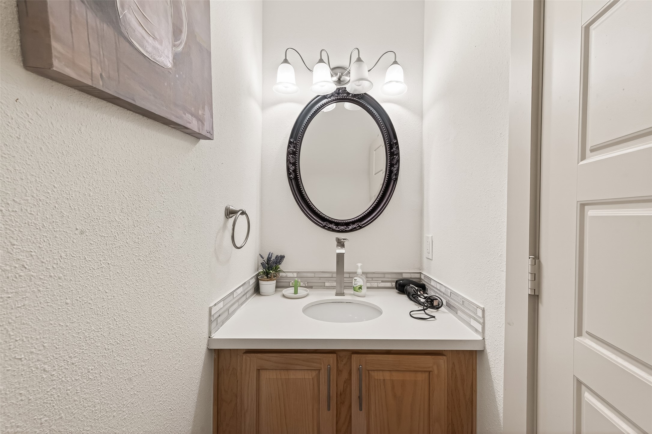 3684 Ocee Street Houston, TX 77063 - Photo 15 of 32 a bathroom with a sink and a mirror