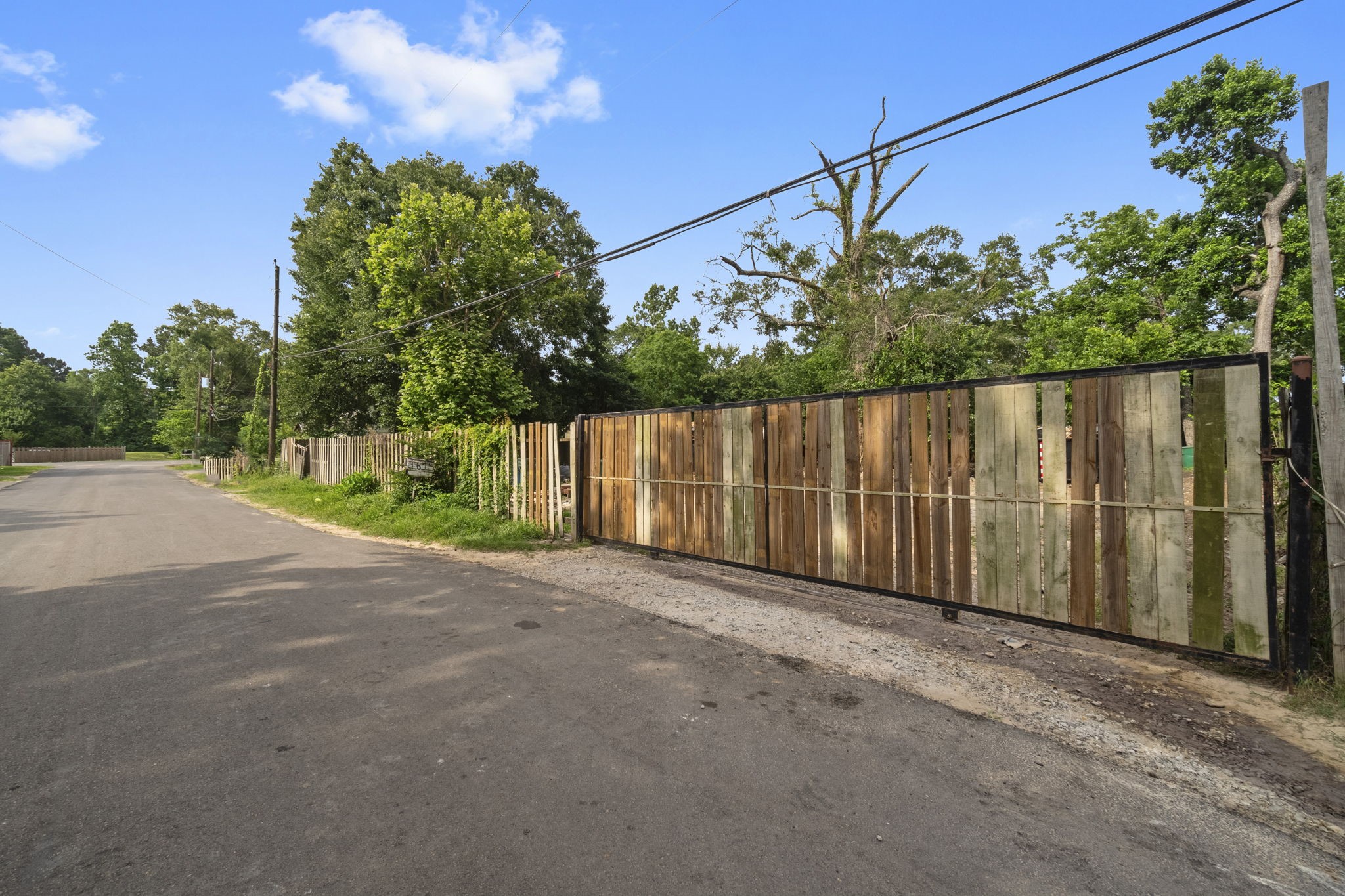 1615 Gilmore Street Conroe, TX 77301 - Photo 5 of 16 a view of a street with a street sign