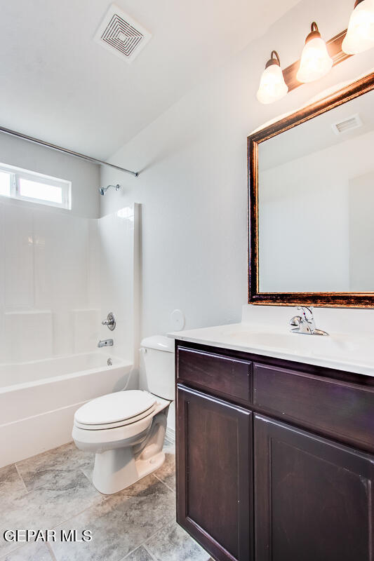 12420 Oconee Place Clint, TX 79836 - Photo 24 of 27 a bathroom with a toilet a sink and mirror