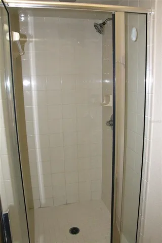 a view of a chandelier fan and entryway