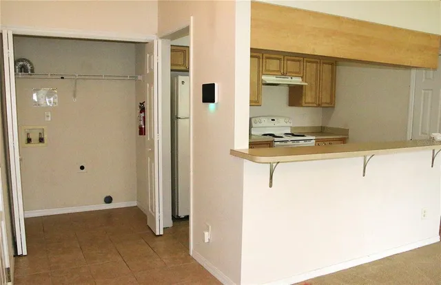 a view of a bathroom from a hallway