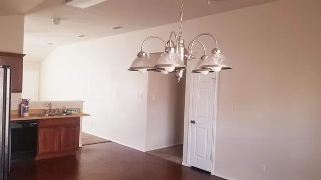 a room with a mirror and a sink