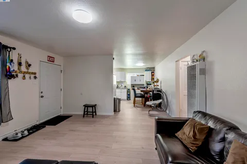 a living room with furniture and gym equipment