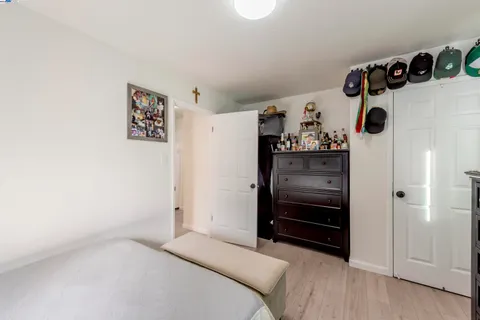 a bedroom with a bed and cabinets