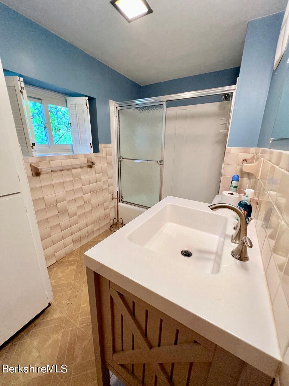 72 Brunell Avenue Lenox, MA 01240 - Photo 11 of 27 a bathroom with a sink and a mirror