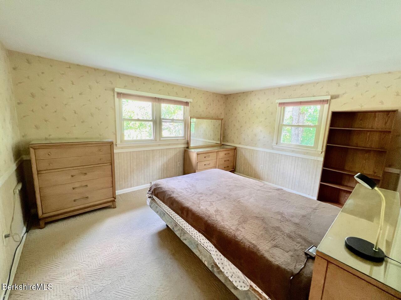 72 Brunell Avenue Lenox, MA 01240 - Photo 12 of 27 a bedroom with a bed and a window