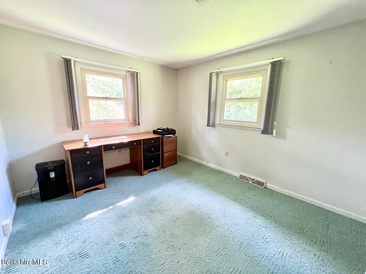 72 Brunell Avenue Lenox, MA 01240 - Photo 13 of 27 a room with a bed and a window