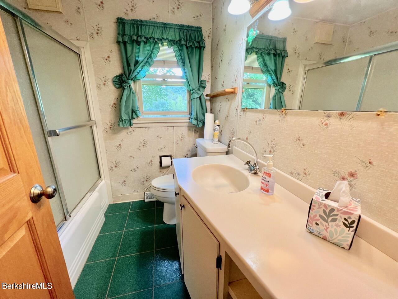 72 Brunell Avenue Lenox, MA 01240 - Photo 14 of 27 a bathroom with a sink and a large mirror