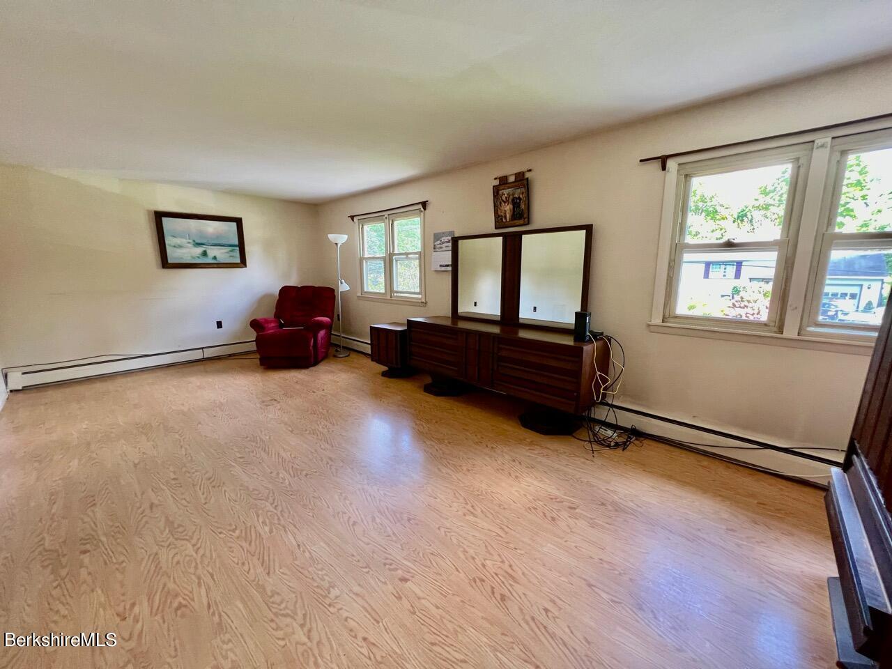 72 Brunell Avenue Lenox, MA 01240 - Photo 15 of 27 a living room with furniture window and a wooden floor