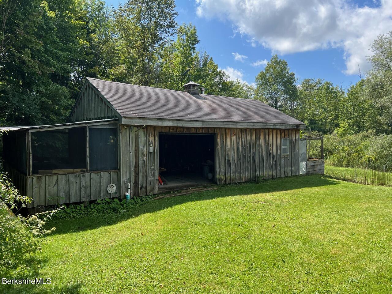 72 Brunell Avenue Lenox, MA 01240 - Photo 2 of 27 a front view of a house with garden