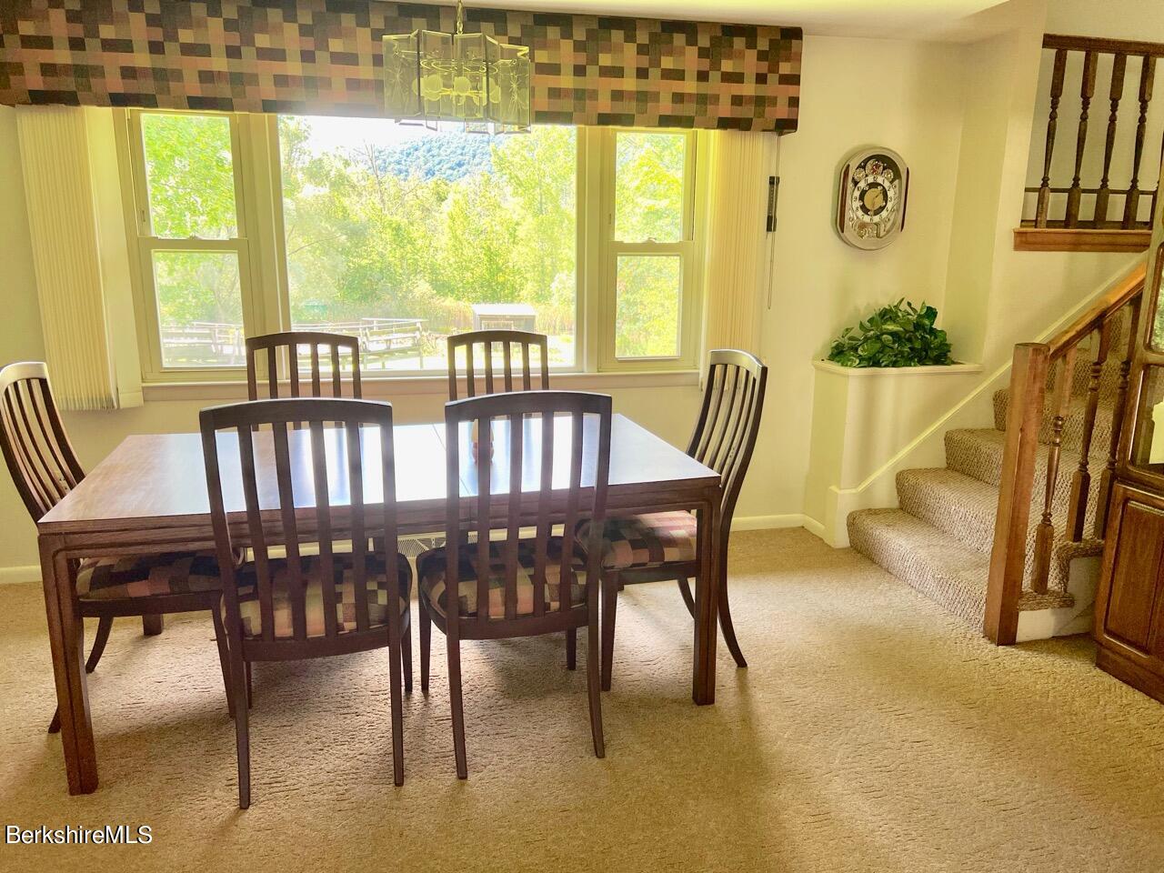 72 Brunell Avenue Lenox, MA 01240 - Photo 3 of 27 a view of a dining room with furniture and a window