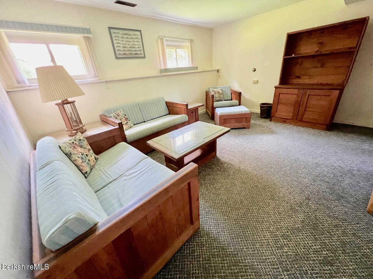 72 Brunell Avenue Lenox, MA 01240 - Photo 6 of 27 a living room with furniture and a rug
