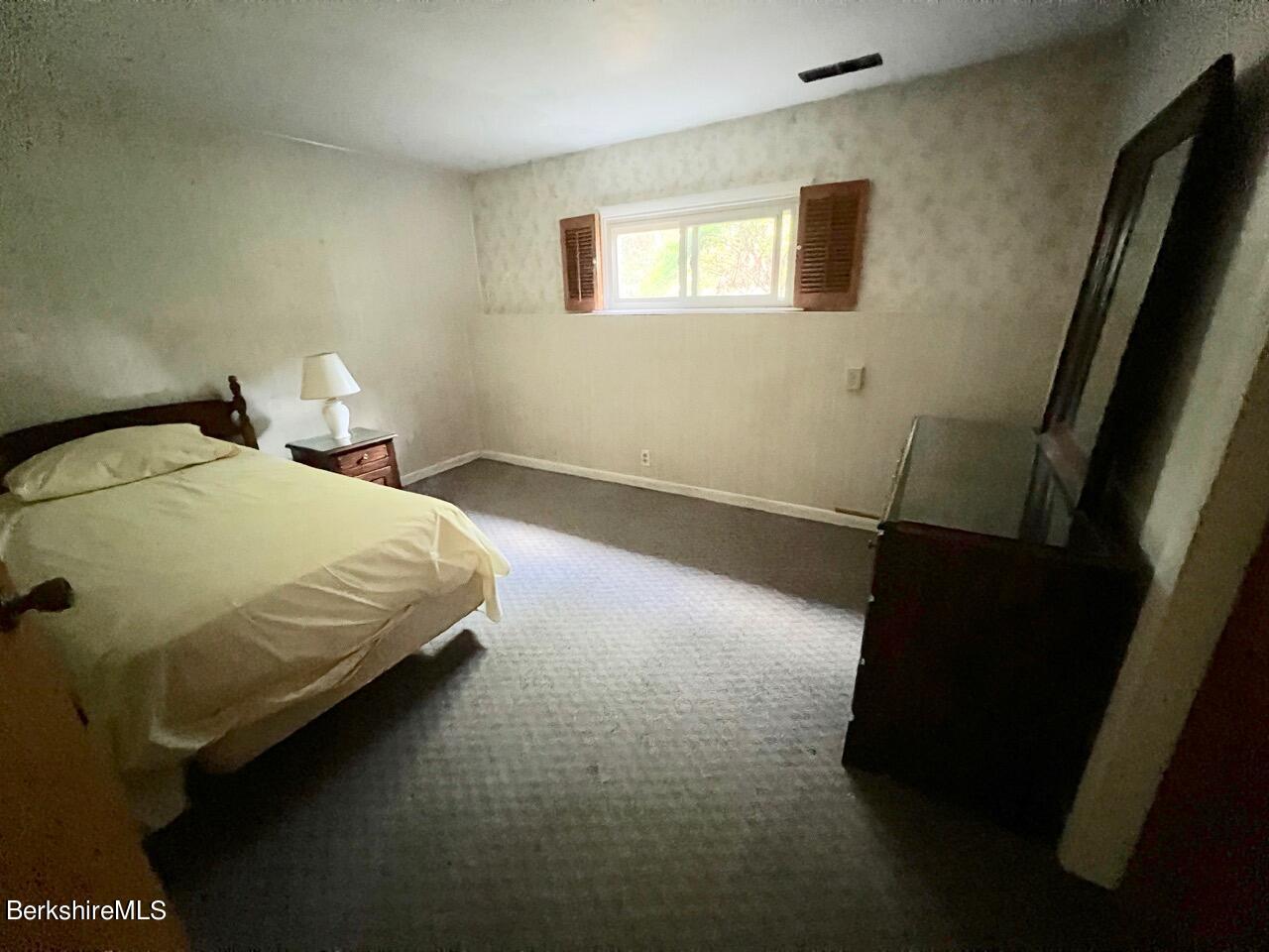 72 Brunell Avenue Lenox, MA 01240 - Photo 9 of 27 a bedroom with a bed and a window