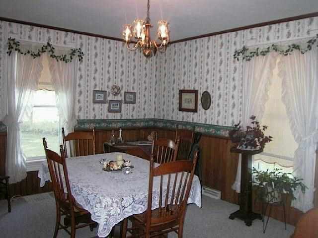 11835 Grange Road Lanark, IL 61046 - Photo 5 of 9 a view of a dining room with furniture and chandelier