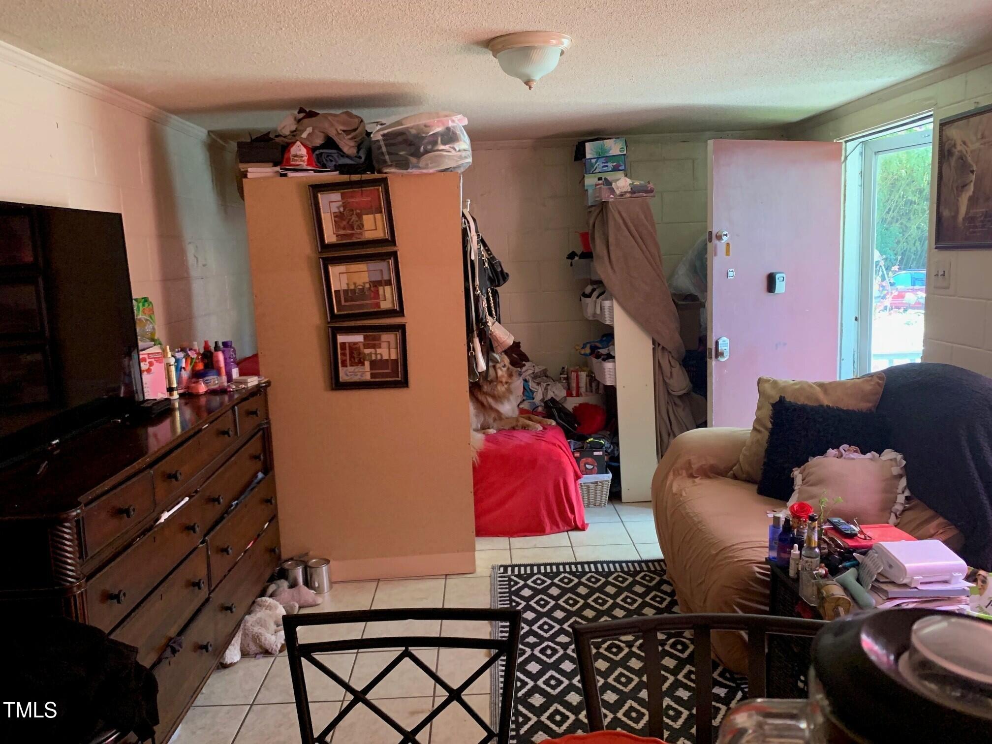 2205 Lafayette Street Durham, NC 27707 - Photo 11 of 17 a living room with furniture a flat screen tv and a couch