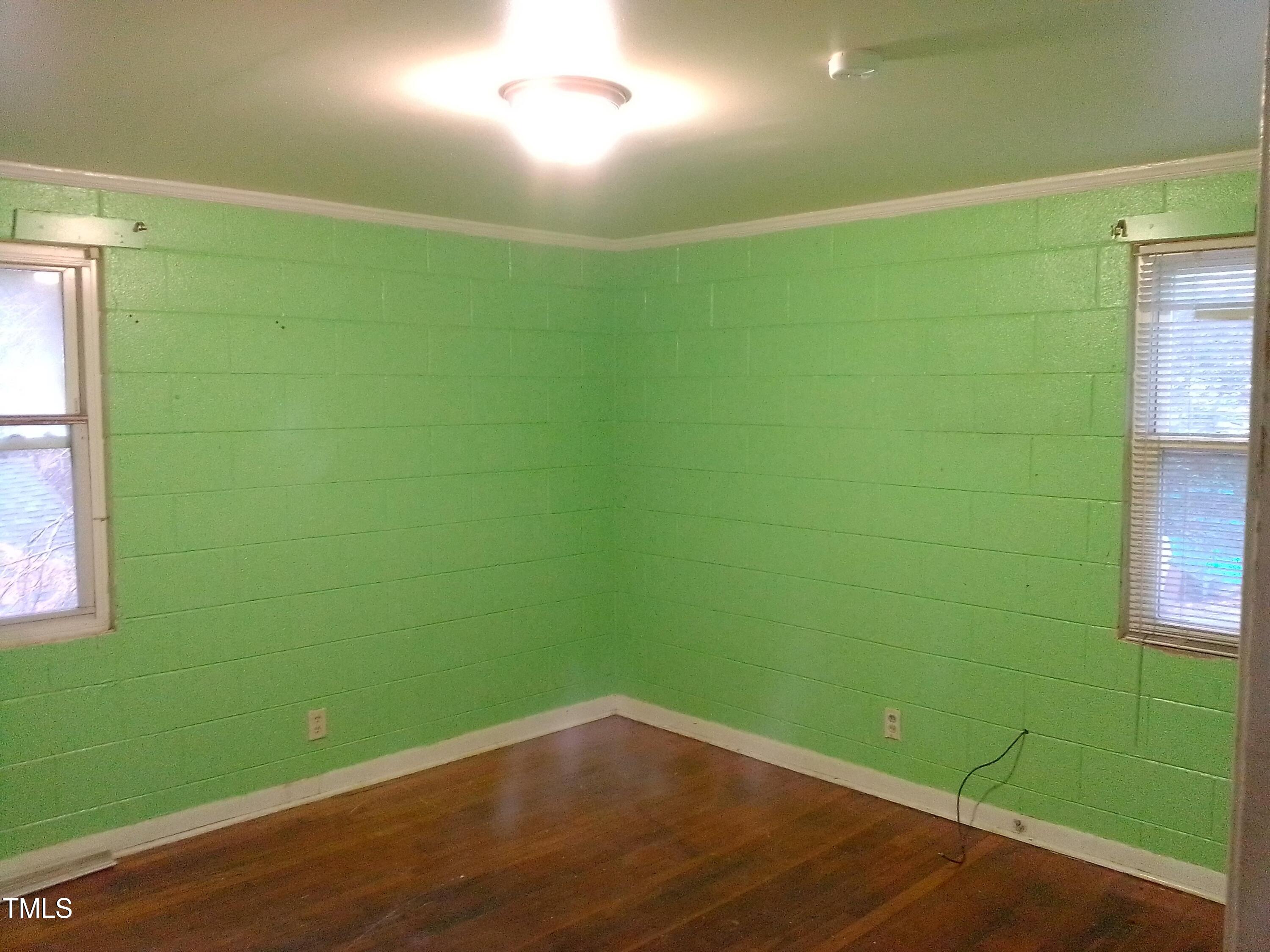 2205 Lafayette Street Durham, NC 27707 - Photo 13 of 17 a view of a room with wooden floor and windows