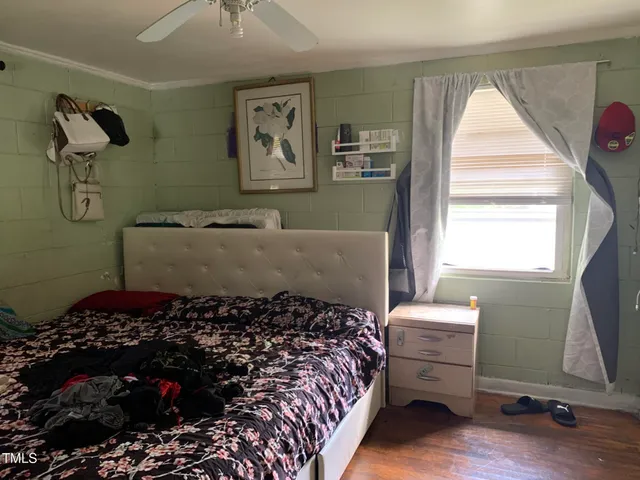 a bed room with a bed and a window