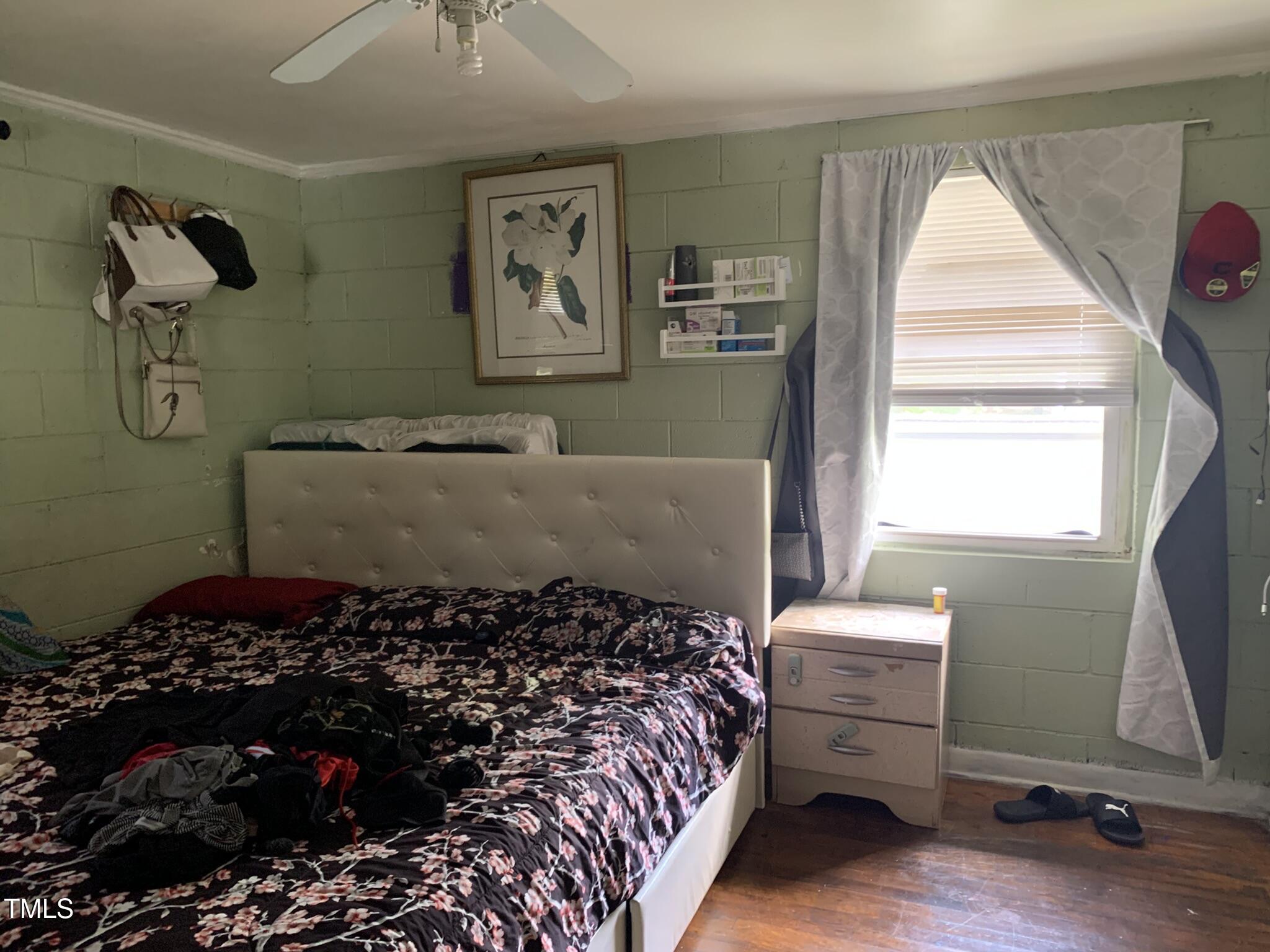 2205 Lafayette Street Durham, NC 27707 - Photo 9 of 17 a bed room with a bed and a window