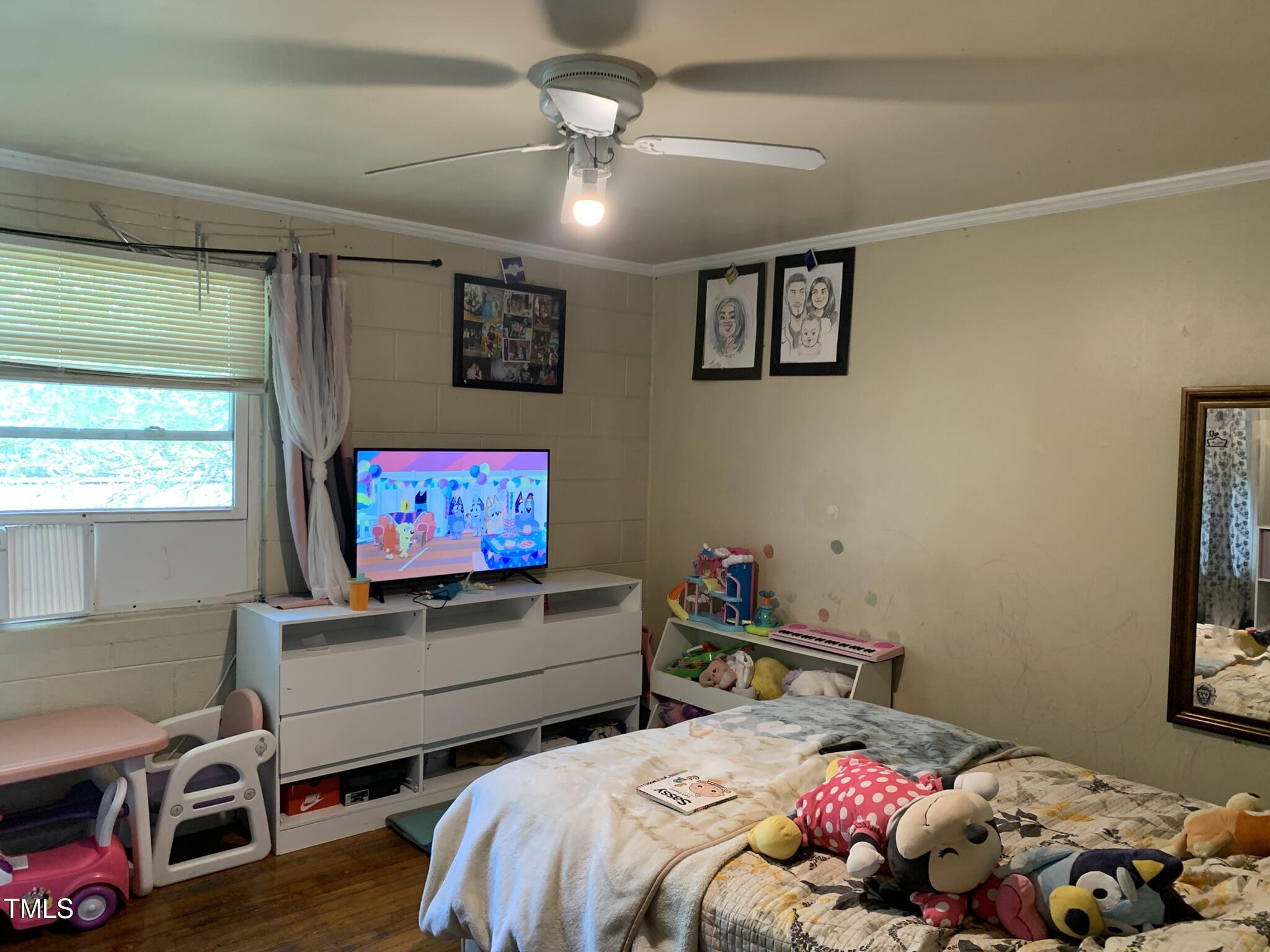 2205 Lafayette Street Durham, NC 27707 - Photo 10 of 17 a bedroom with bed and a window
