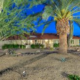 a blue sign that is in front of a house