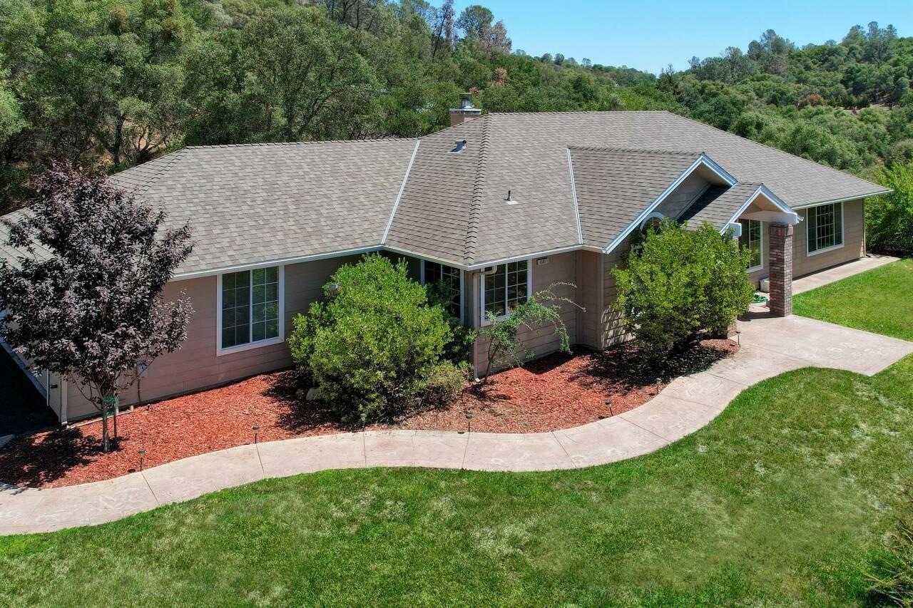 46911 Veater Ranch Road Coarsegold, CA 93614 - Photo 1 of 41 a aerial view of a house next to a yard