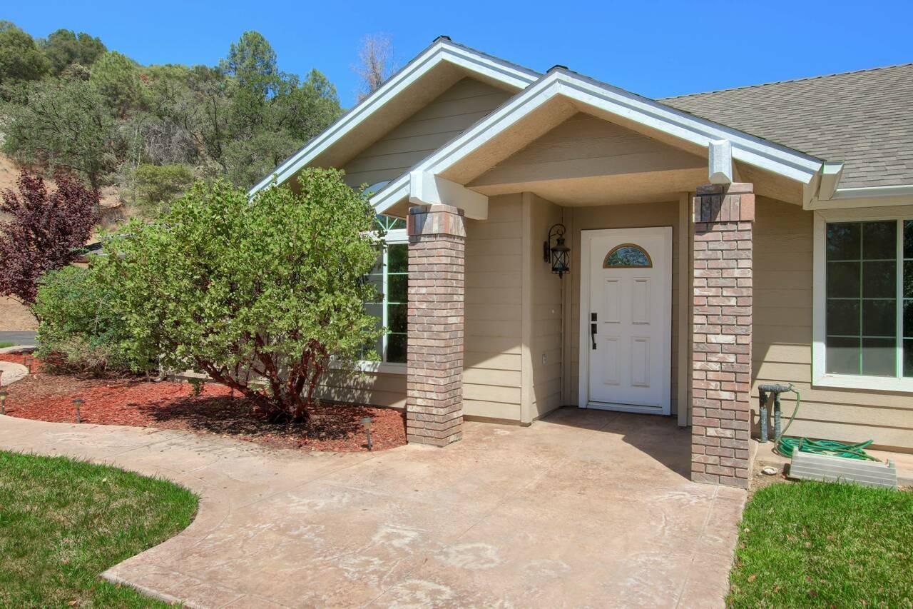 46911 Veater Ranch Road Coarsegold, CA 93614 - Photo 2 of 41 a view of a house with a yard