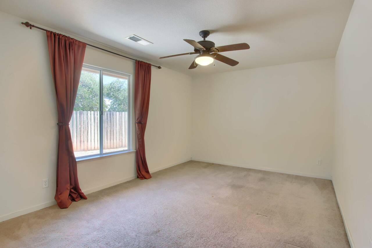 46911 Veater Ranch Road Coarsegold, CA 93614 - Photo 23 of 41 a view of an empty room with chandelier fan and a window