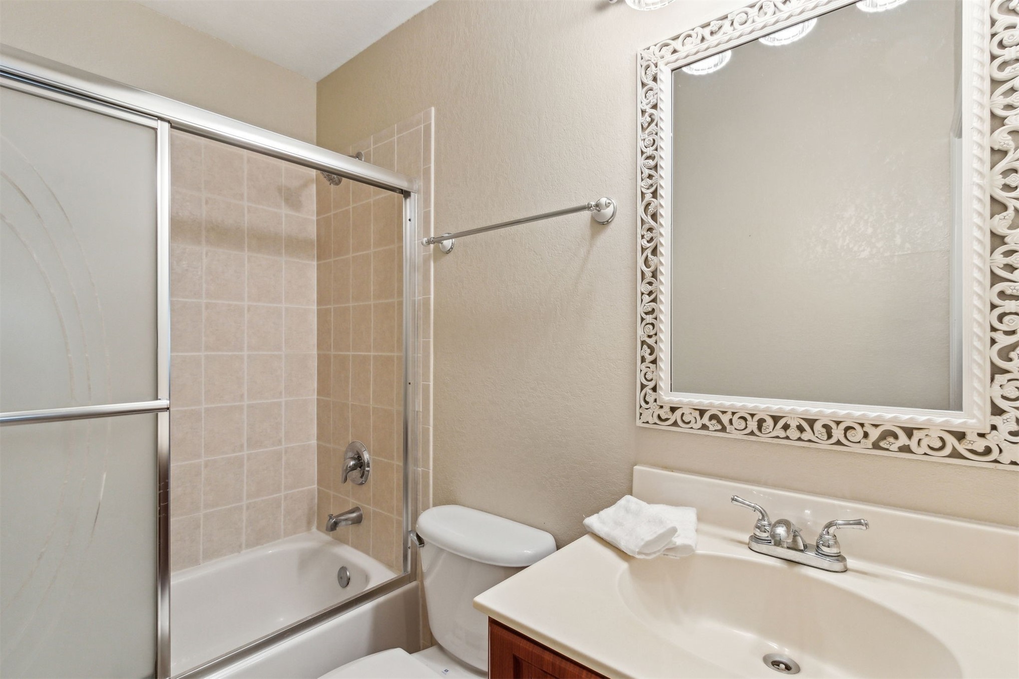 9745 Touchton Road Jacksonville, FL 32246 - Photo 14 of 20 a bathroom with a sink and a mirror