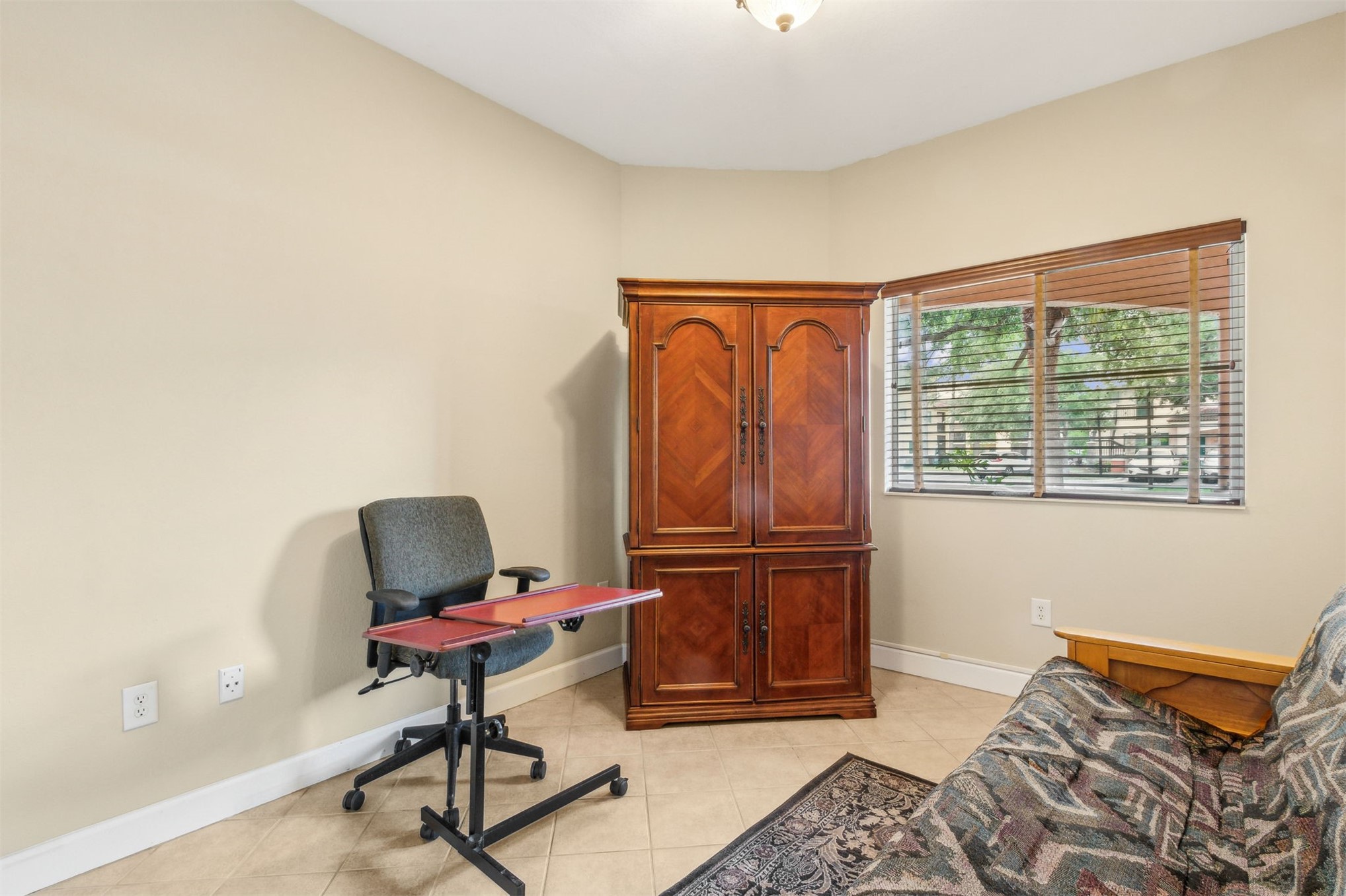 9745 Touchton Road Jacksonville, FL 32246 - Photo 15 of 20 a bedroom with furniture and a window