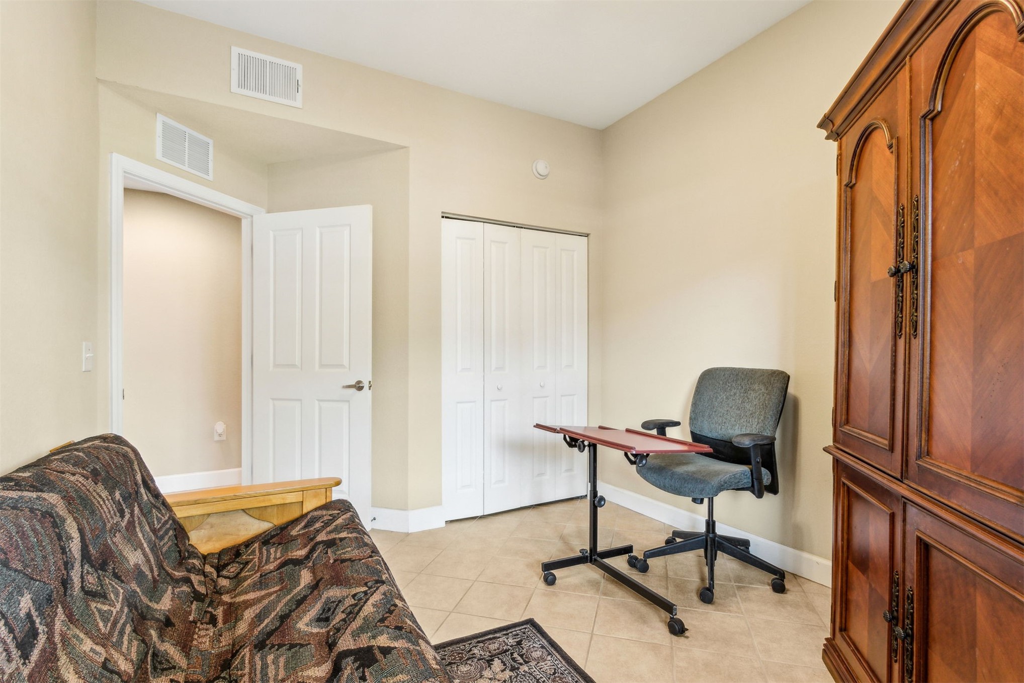 9745 Touchton Road Jacksonville, FL 32246 - Photo 16 of 20 a view of a workspace with furniture and a window