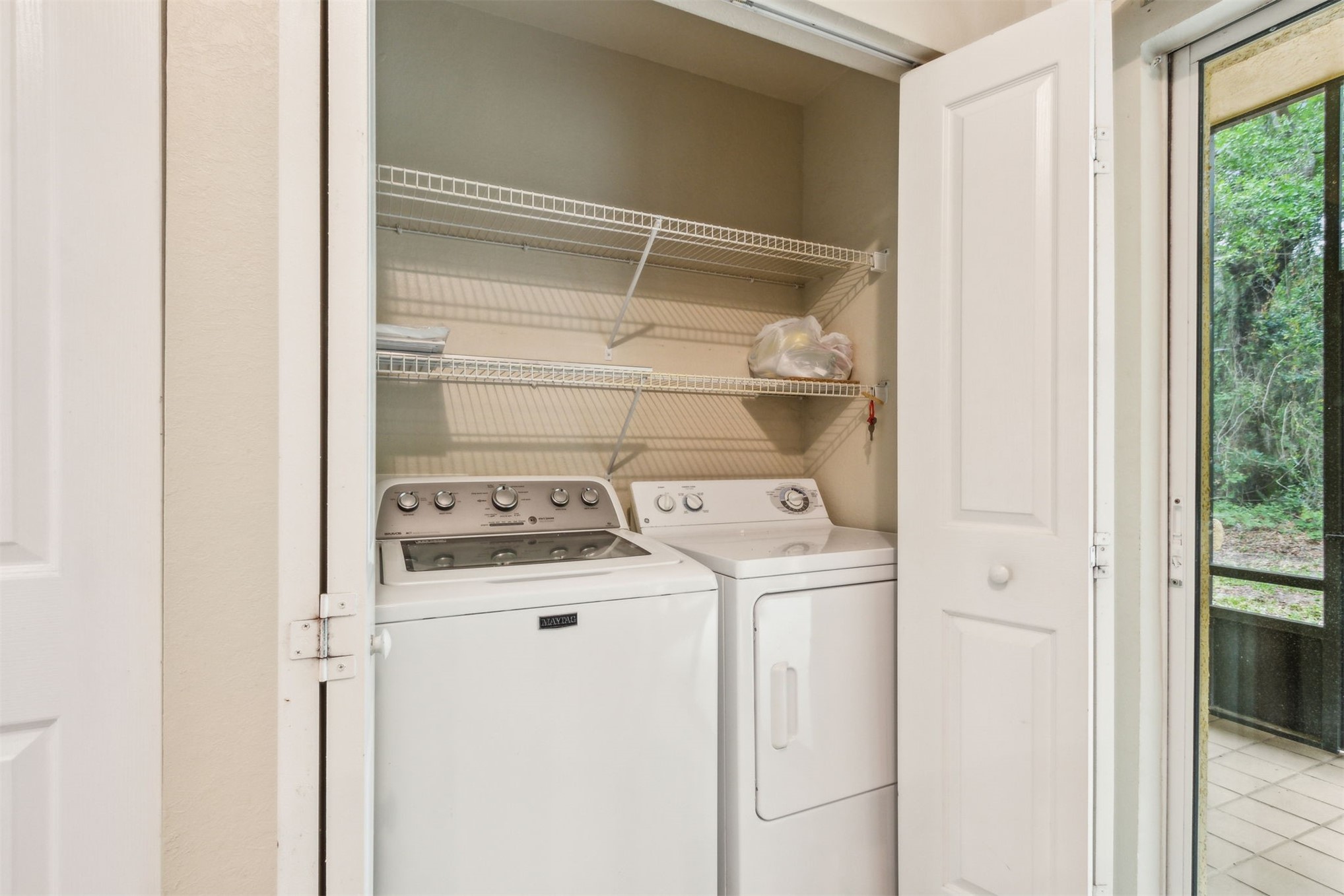 9745 Touchton Road Jacksonville, FL 32246 - Photo 17 of 20 a utility room with dryer and washer