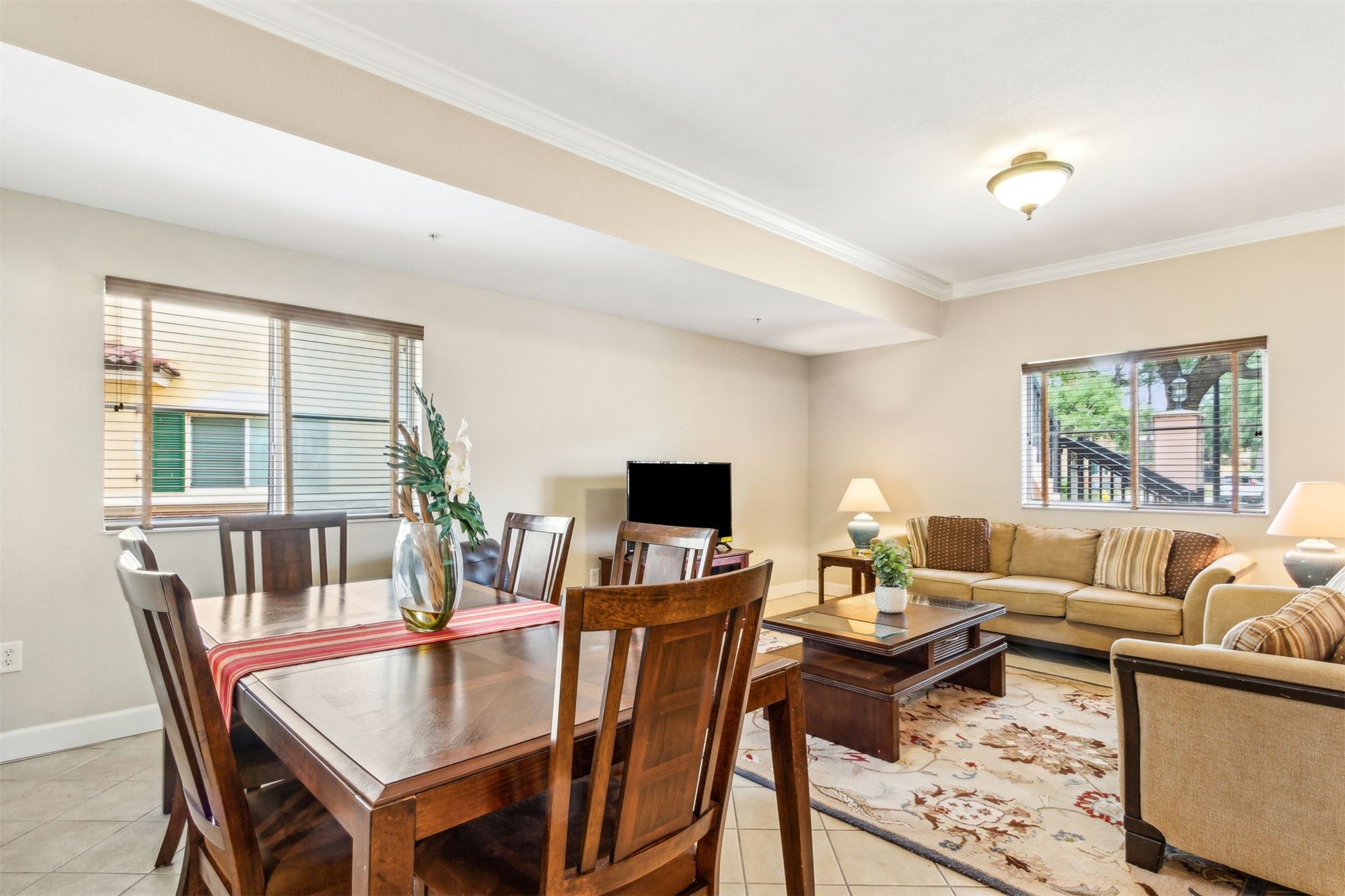 9745 Touchton Road Jacksonville, FL 32246 - Photo 4 of 20 a living room with furniture and a flat screen tv