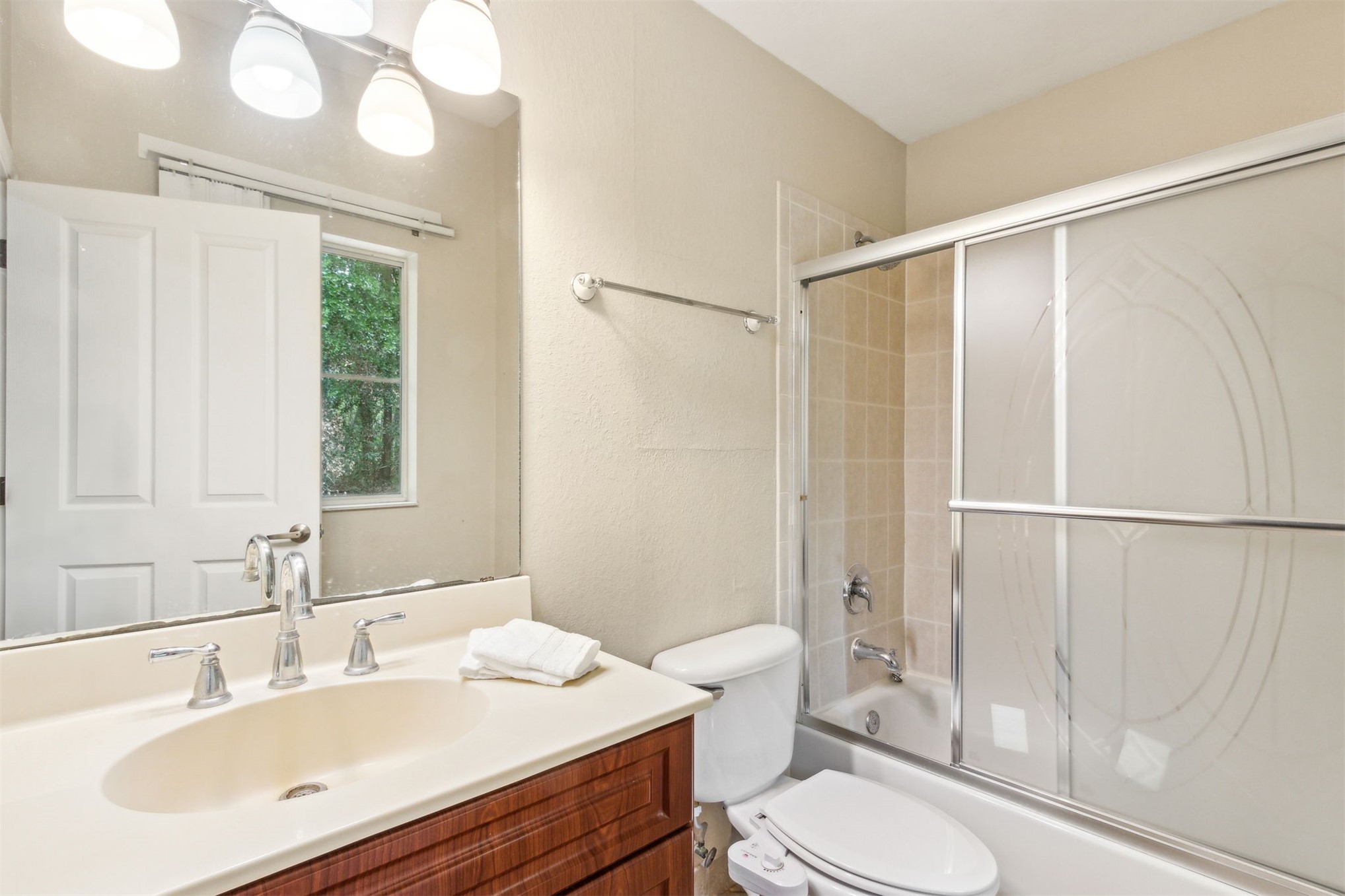 9745 Touchton Road Jacksonville, FL 32246 - Photo 10 of 20 a bathroom with a sink toilet and shower