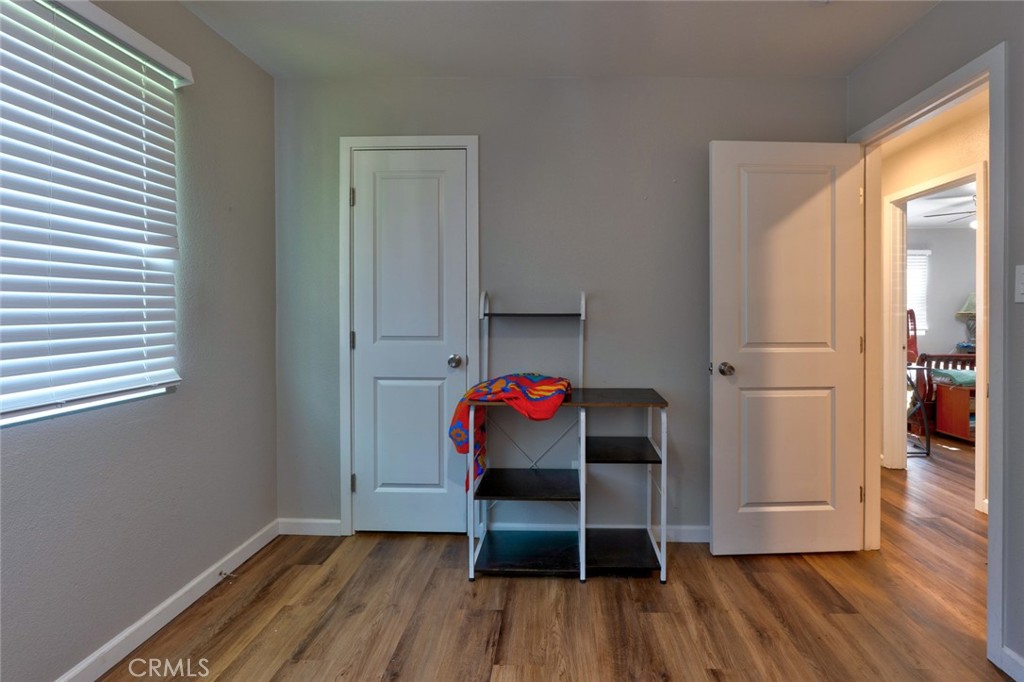 1840 Cheyenne Drive Merced, CA 95348 - Photo 33 of 90 a view of a room with wooden floor closet and windows