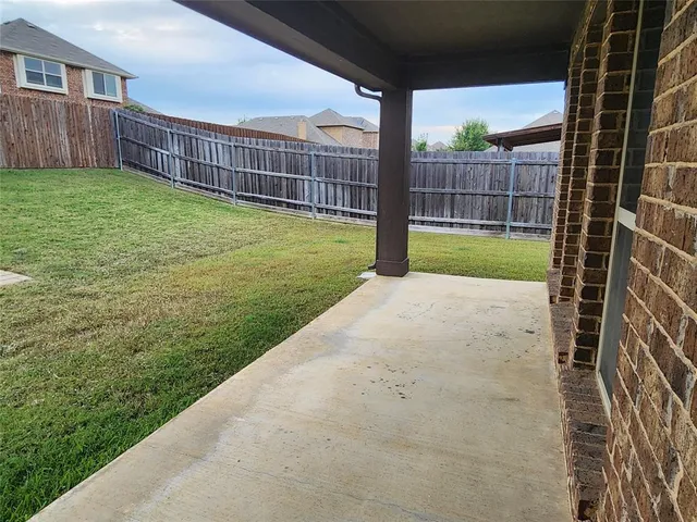a view of a backyard with a garden