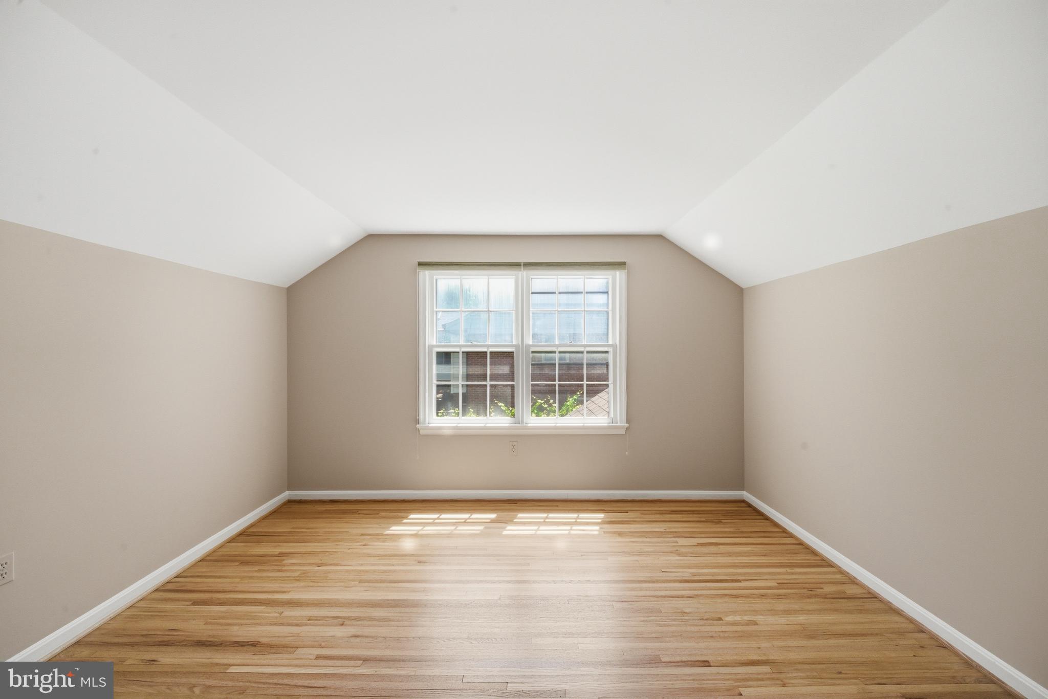 13309 Old Forge Road Silver Spring, MD 20904 - Photo 33 of 52 an empty room with wooden floor and windows