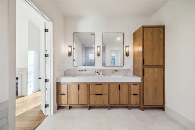a bathroom with a double vanity sink mirror and double